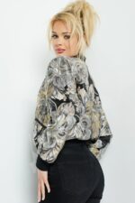 Model wearing Jovani M51288 multi-colored floral bomber jacket, showing the side and back.