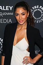 close-up of model wearing M392 black dress and blazer ensemble