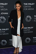 model wearing M392 elegant black dress with fitted silhouette and black blazer