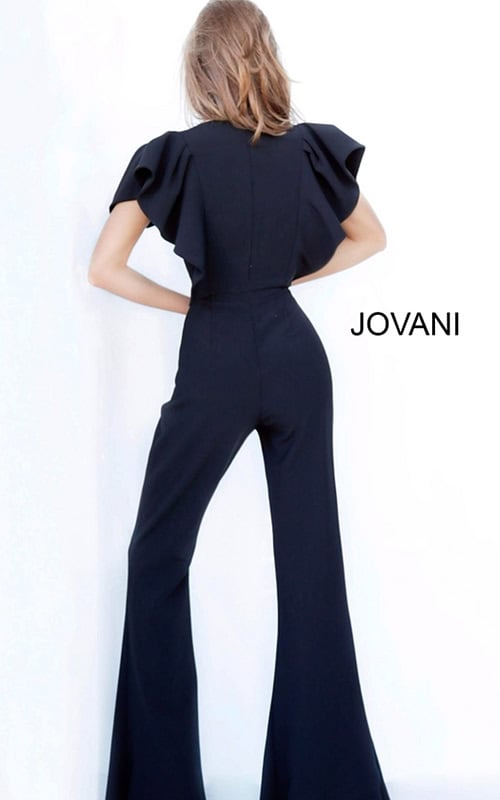 Model wearing Jovani 00762 black jumpsuit with V-neckline and flutter sleeves, front view.