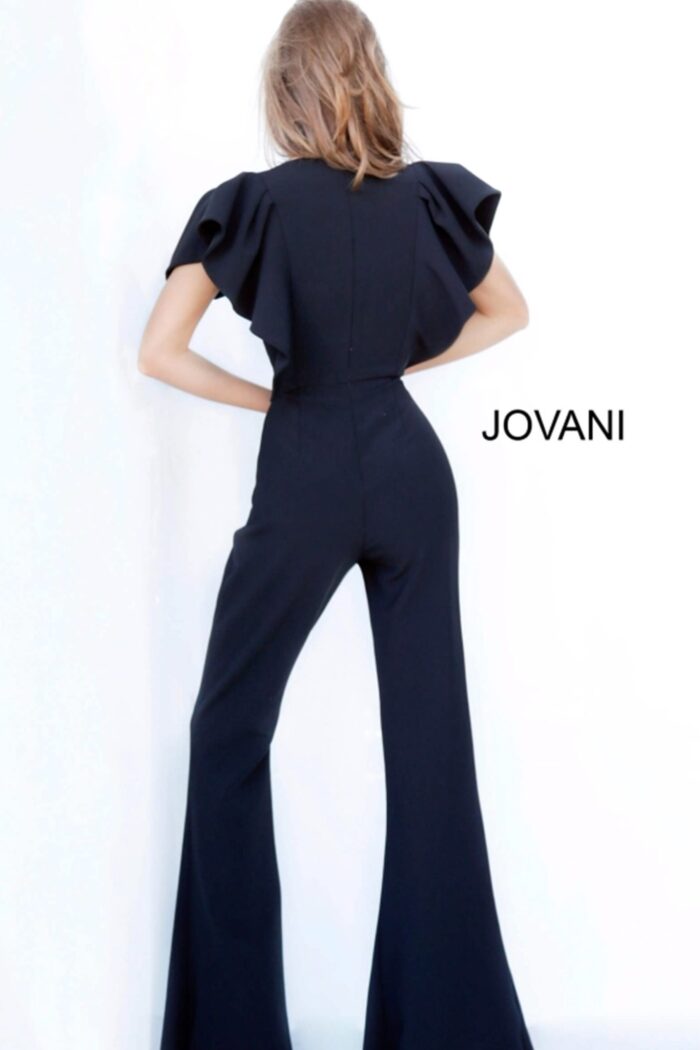 Model wearing Jovani 00762 black jumpsuit with V-neckline and flutter sleeves, front view.