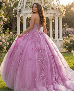 Lace-up back pink ball gown with layered tulle skirt and floral detailing