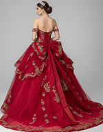 Off-shoulder red ball gown with oversized bow and gold embroidery