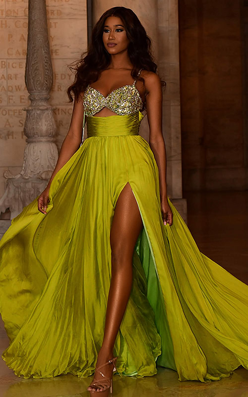 Model wearing Jovani S05823 with sweetheart neckline and high slit in green, front view