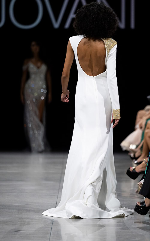 Back view of Jovani S38446 white gown showcasing an open back and fitted silhouette.