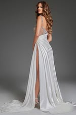 Model wearing Jovani S40406 white gown showcasing the elegant back drape and high slit.