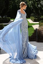 Elegant gown featuring crystal embroidery and flowing chiffon cape