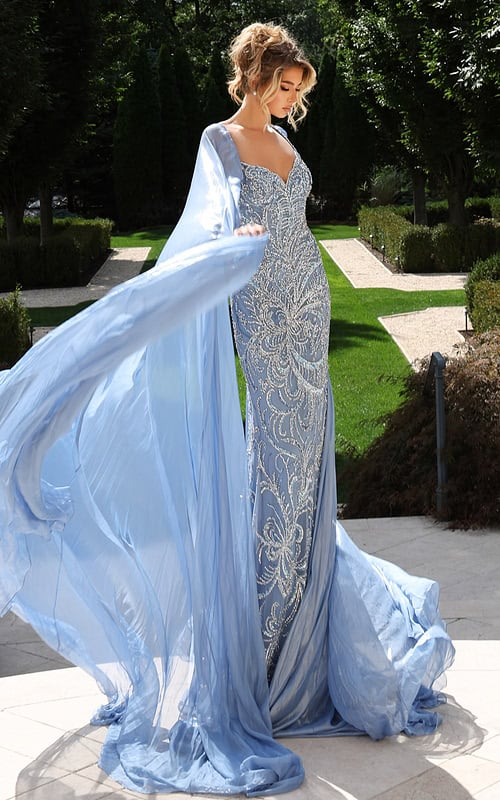Elegant gown featuring crystal embroidery and flowing chiffon cape
