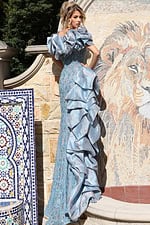 Light blue embellished dress featuring structured sleeves and high slit