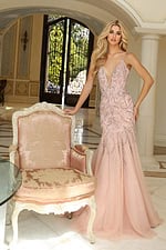 Elegant pink gown with sequin embroidery and flowing tulle layers