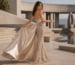 Backless evening gown with sequin detail and flowing satin train