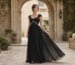 black A-line evening gown with empire waist and sweetheart neckline
