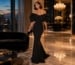 Black architectural mermaid gown in cinematic gala lounge