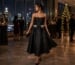 Black satin midi dress at corporate holiday reception