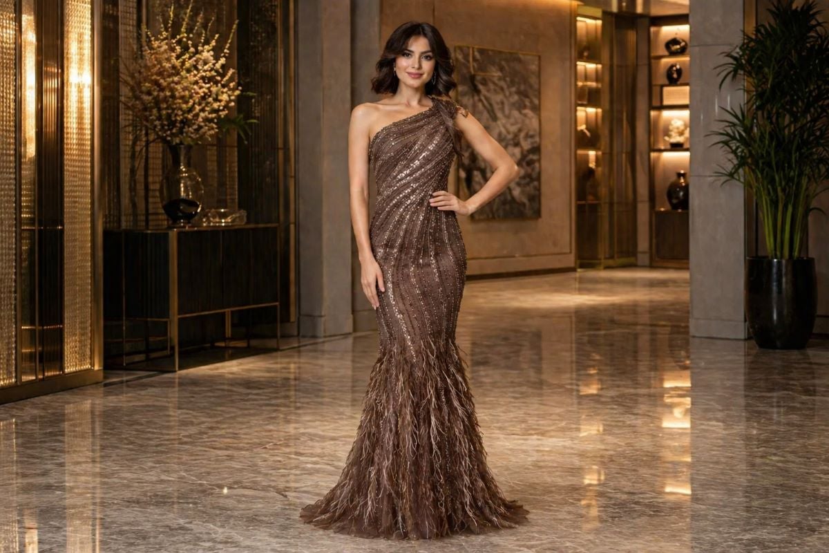 Bronze one-shoulder beaded evening gown with feathered mermaid skirt