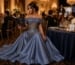 Woman in elegant steel blue charity auction gown