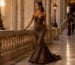 Chocolate brown mermaid prom dress at luxury gala entrance