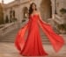 Coral red chiffon graduation gown with flowing draped panels