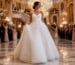 Debutante entering grand ballroom in white gown