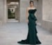 Deep green strapless evening gown with structured ruffle detail
