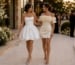Bride-to-be and guest in chic white engagement party dresses