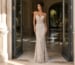 Fitted embellished illusion prom gown with crystal beadwork and plunge neckline