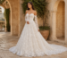 Bride in floral lace A-line wedding gown with detached lace sleeves