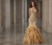 Gold strapless mermaid evening gown with beaded bodice