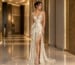 Ivory and gold sequin prom dress with deep V neckline and high slit