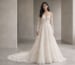 Ivory lace A-line wedding dress with sheer bodice and long lace sleeves