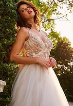 Close-up of Jovani jb05781, highlighting the intricate embroidery on an ivory gown.