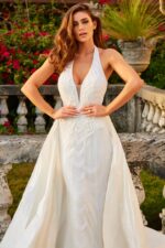 Model wearing jb07451 white gown with plunging V-neckline, front view