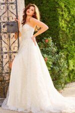 Model showing back of JB07578 ivory gown with intricate detailing.