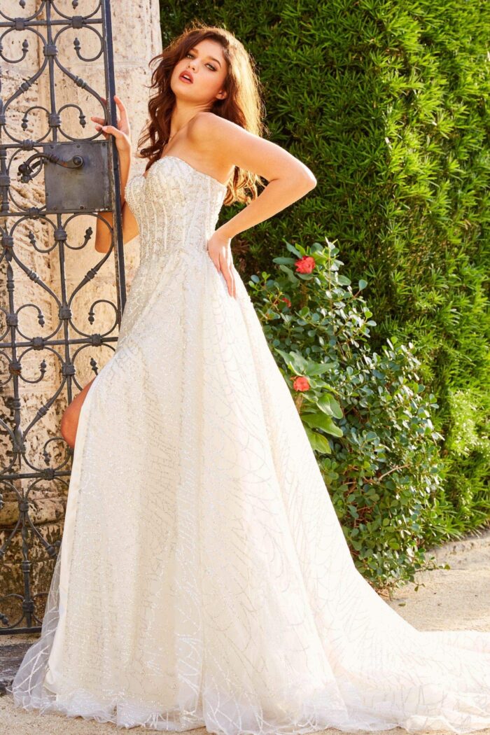 Model showing back of JB07578 ivory gown with intricate detailing.