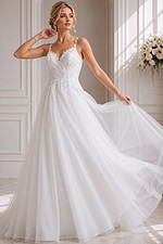 princess-style wedding dress with airy tulle layers and feminine floral accents.