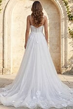 Back view of floral appliqué tulle bridal gown with thin straps and long flowing train