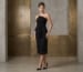 Black lace midi cocktail dress for formal events in a modern architectural lobby