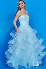 Child model in Jovani K02442 blue dress, back view.