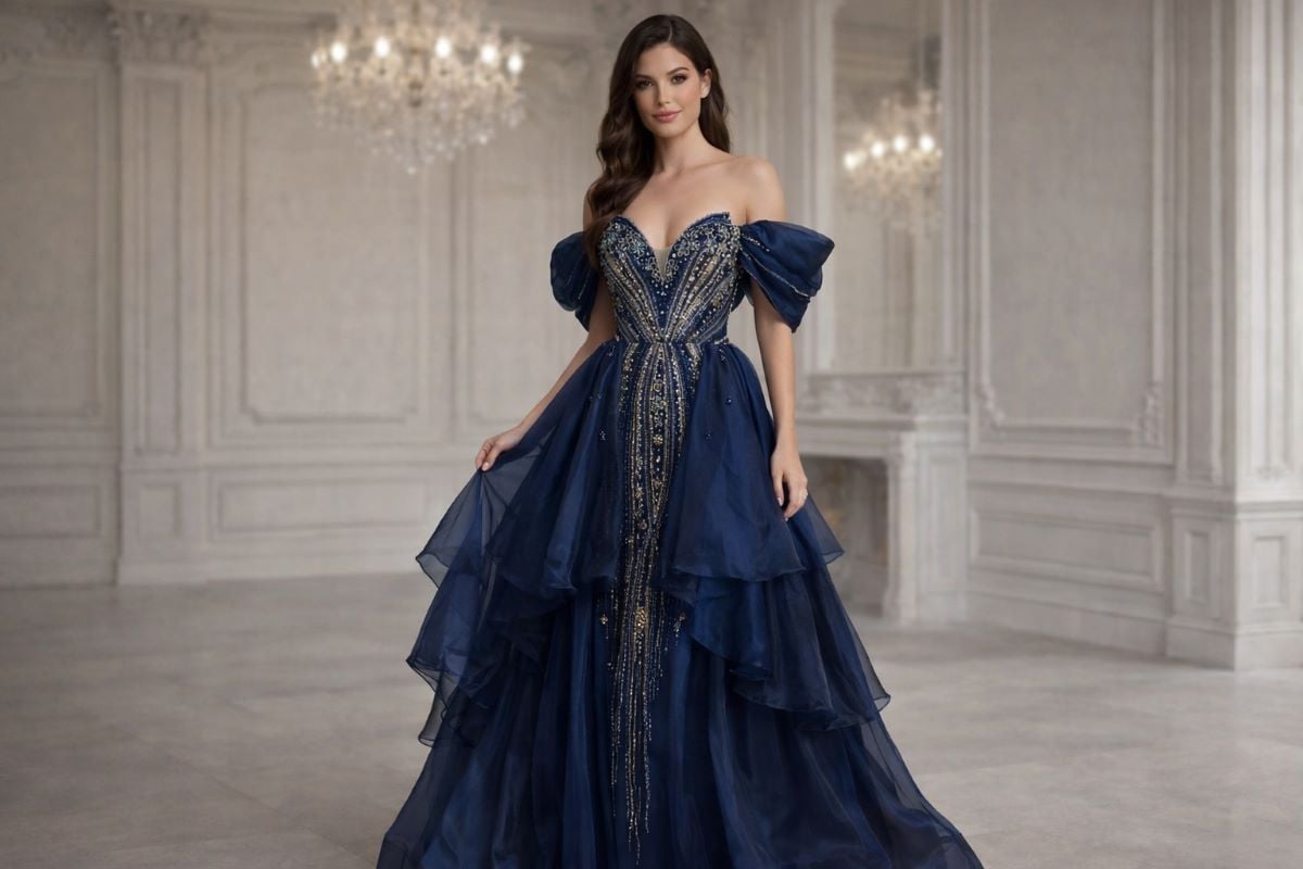 Navy off shoulder gown with beaded bodice and tiered skirt