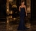Woman wearing navy sculptural mermaid evening gown