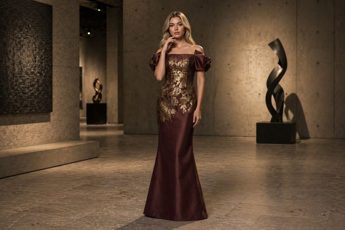 Off-shoulder evening gown with puff sleeves and gold pattern