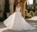 Ivory floral appliqué ball gown in luxury outdoor wedding setting