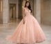 Peach tulle ball gown with floral appliqué for quinceanera guest