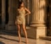 Petite woman in gold cocktail dress