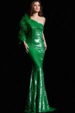 Model wearing Jovani 23980 green sequin gown with one-shoulder design and feather detailing on the left side.