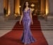 Purple embellished mermaid evening gown on red carpet entrance