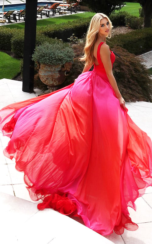 Model wearing two-tone chiffon gown with ruched bodice and flowing skirt